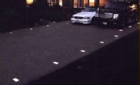 low voltage paver lights integrated into a paver driveway