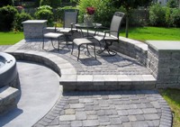 Paving bricks used to create a patio, walkway and retaining wall